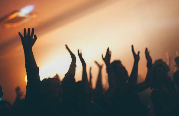 people raising hands on white room